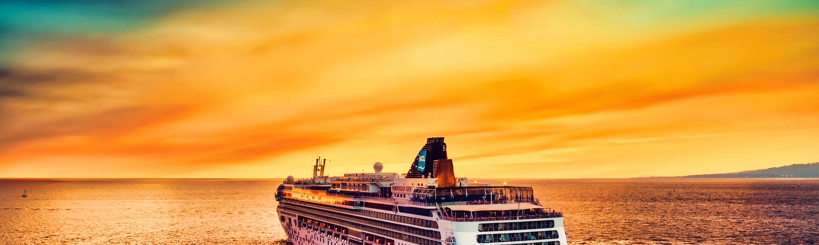 Picture of a cruise ship, sailing off into the open ocean, with the sun setting casting a golden beam of rays onto the boat.