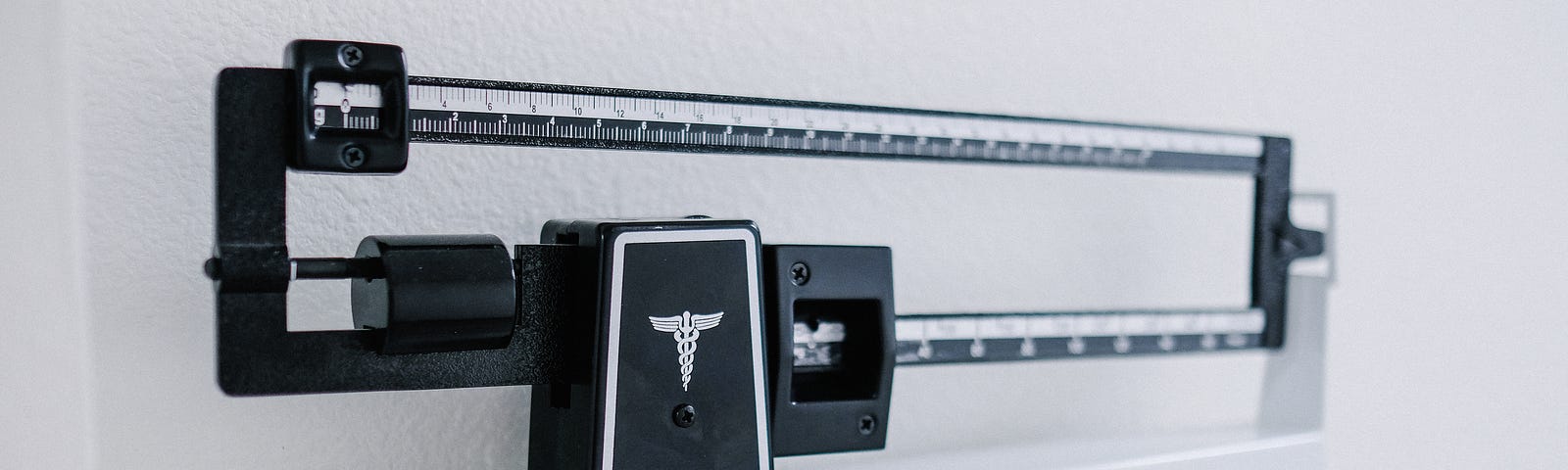 An upright medical scale.