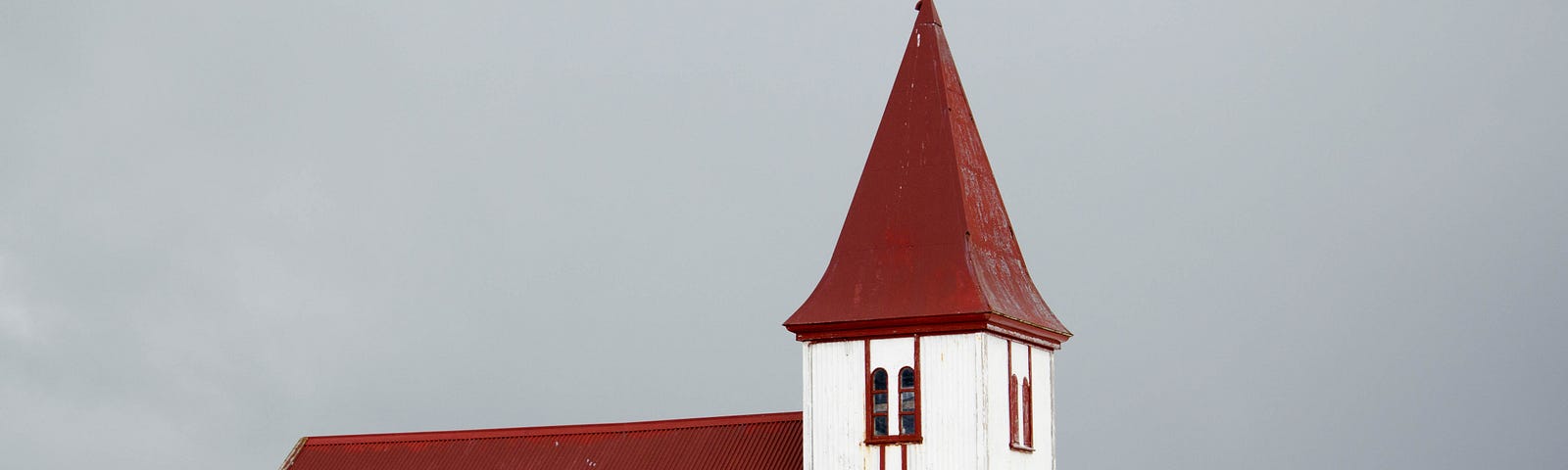 Church building with red roof.