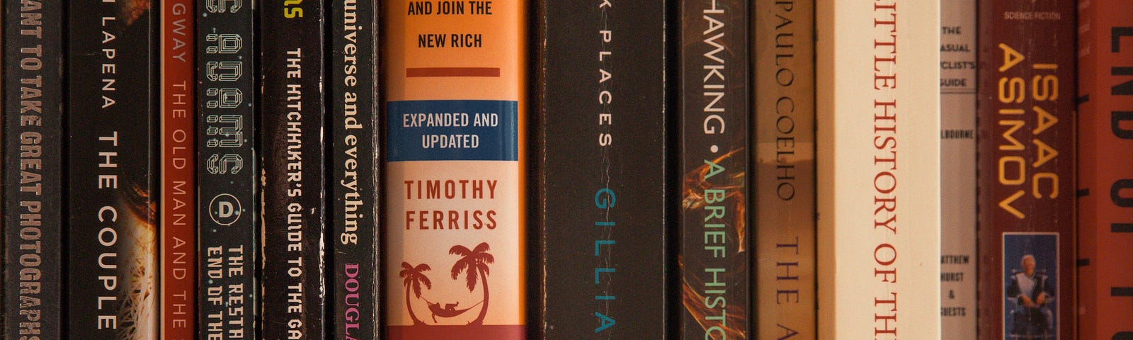 Closeup of book spines along a bookshelf