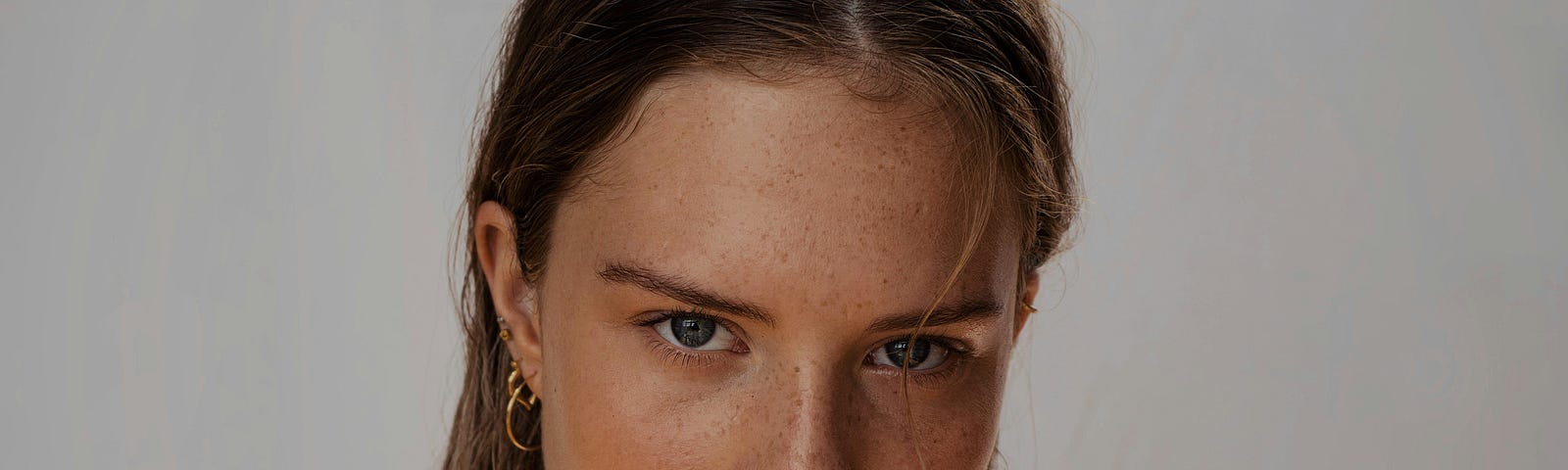 Headshot of a woman with a fierce, determined look on her face.