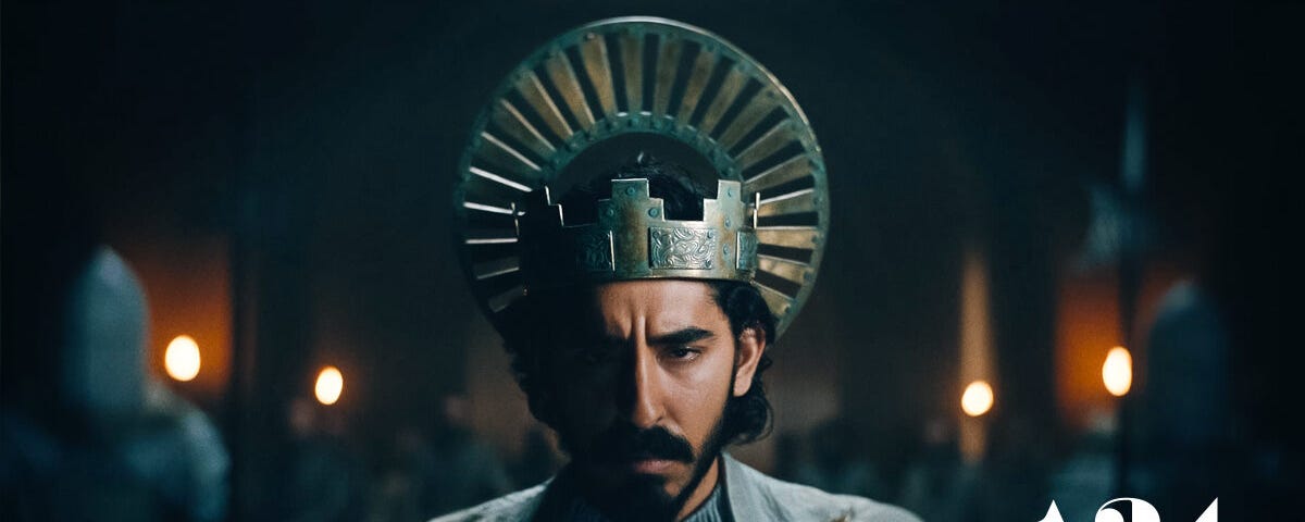 Dev Patel as Sir Gawain wearing a crown in the A24 movie “The Green Knight.”