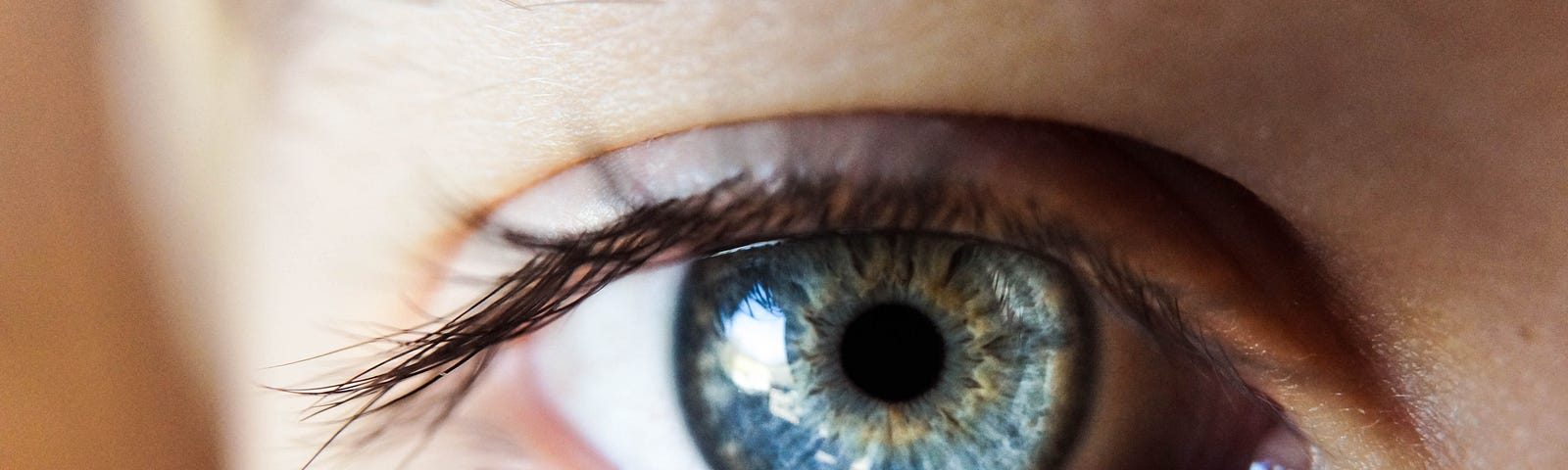 close-up of a woman’s clear blue eye