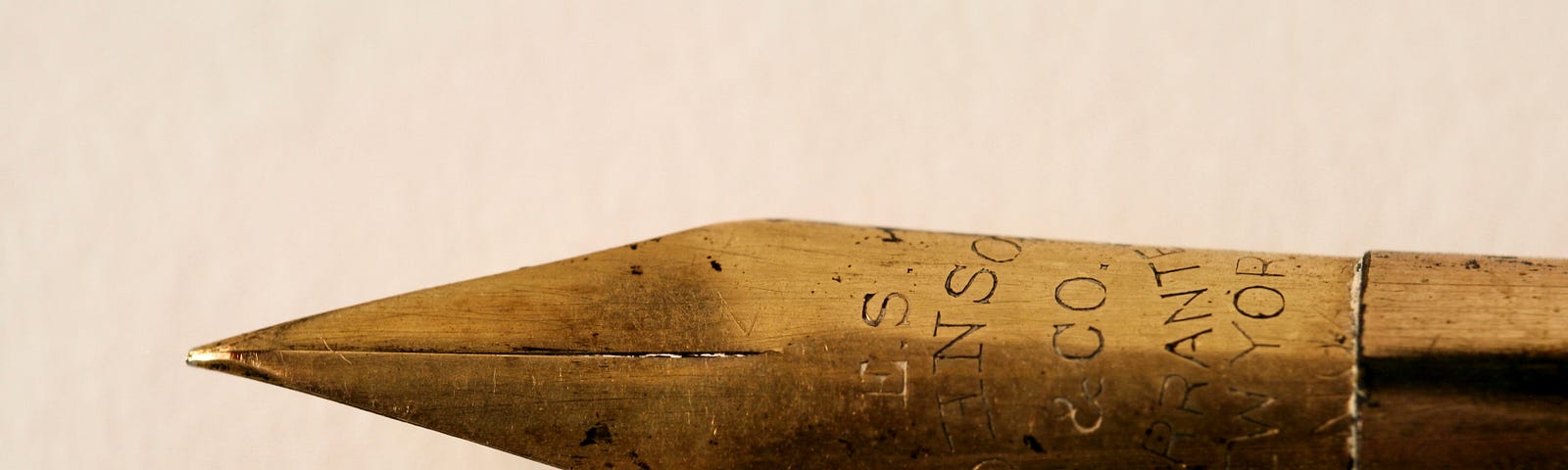 A close up of the nib of an antique ink pen