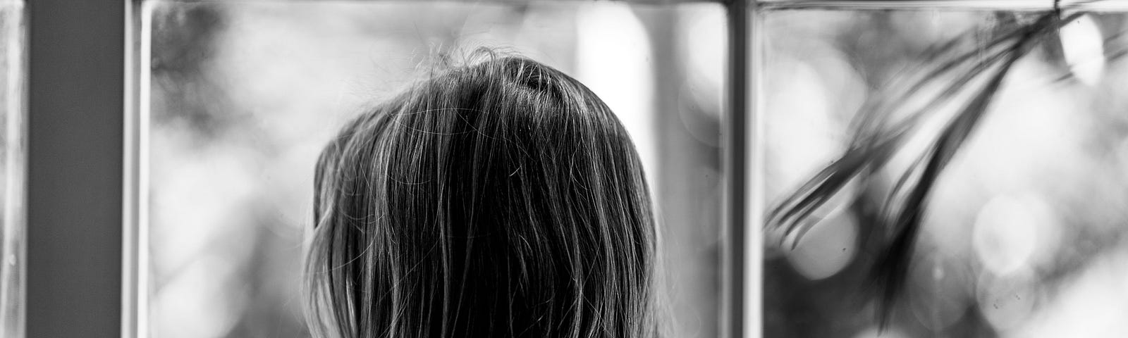 girl looking out the window