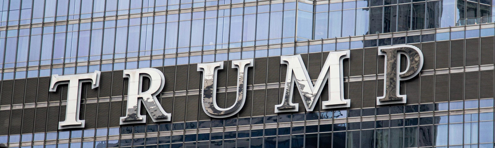 The big, beautiful Trump name adorns an office building.