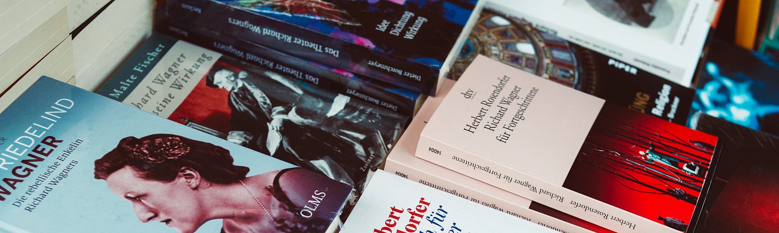 A table with lots of new books laid out as if on sale.