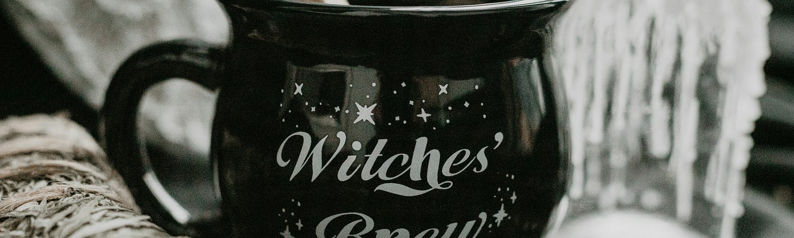 A mug that says Witches Brew.