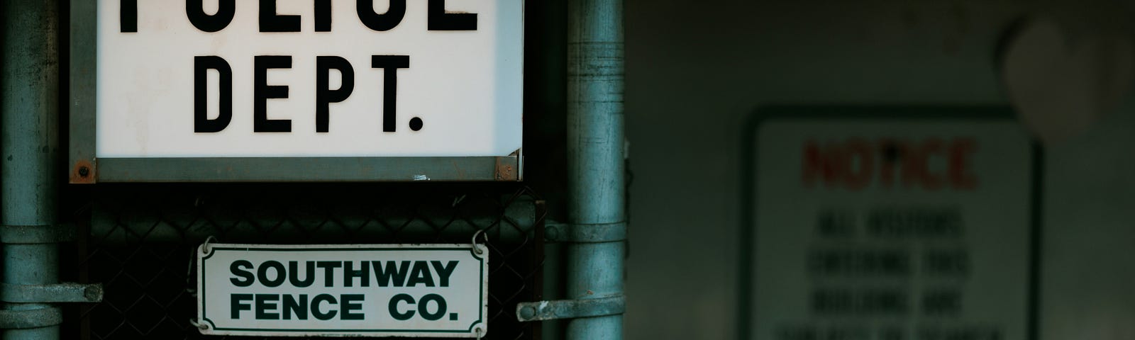 An illuminated sign reading “POLICE DEPT.”