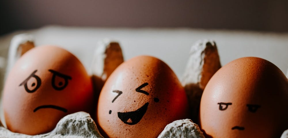 There are three eggs that represent different emotions: scared, happy and bothered.