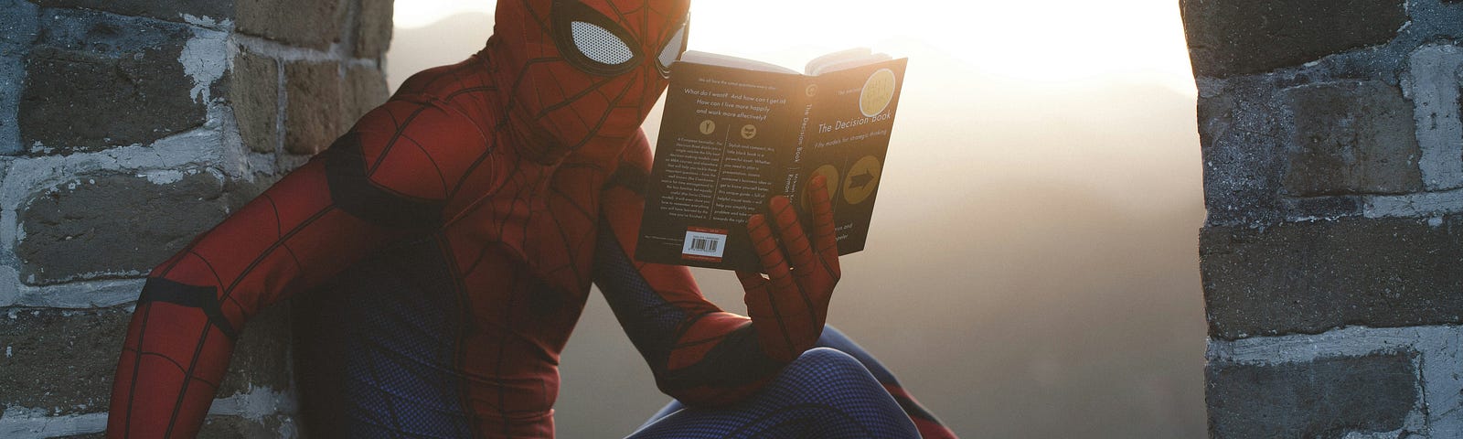 spider man reading a book while working as a hero, to illustrate the power of applied interest to become unstoppable in life