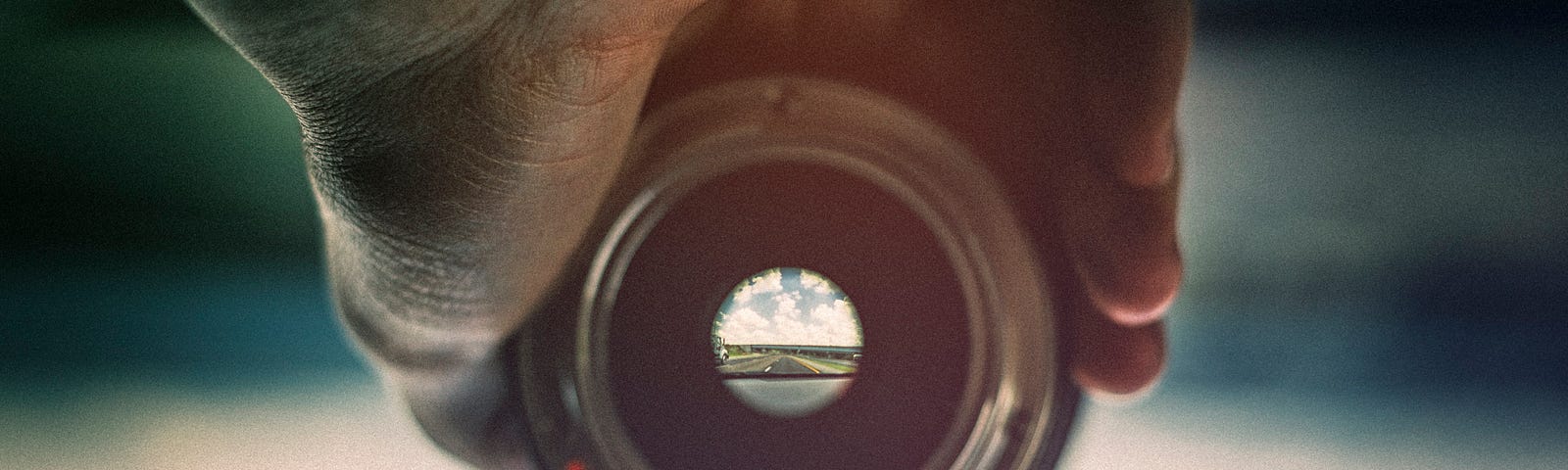 Seeing a landscape upside down and in focus through a small hole in a camera lens