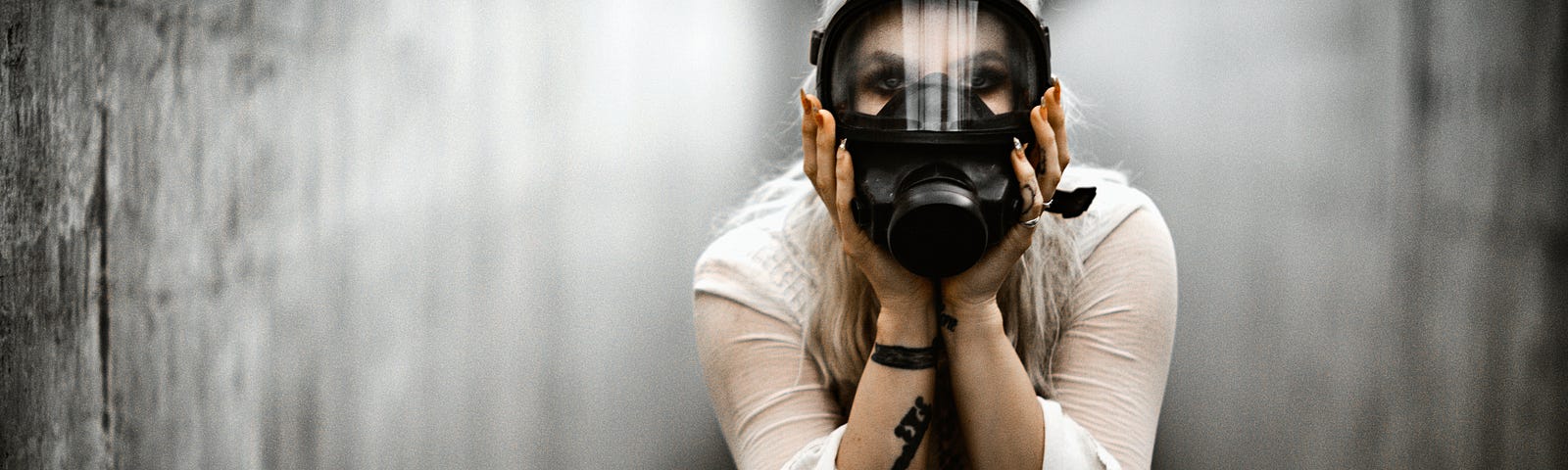 a lady with a gas mask on