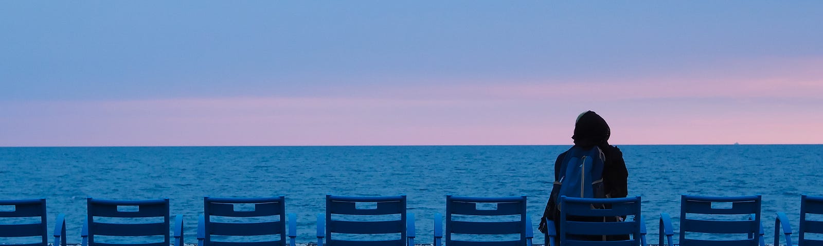 A woman faces away from us on a beach chair facing theocean. There are five chairs to her left and two to her right. Did you know that powerful magnetic pulses applied to the brain can help many with refractory depression? But we have not had a good understanding of transcranial magnetic stimulation’s mechanism of action. New Stanford Medicine (USA) research provides insights into how magnetic stimulation treats severe depression.