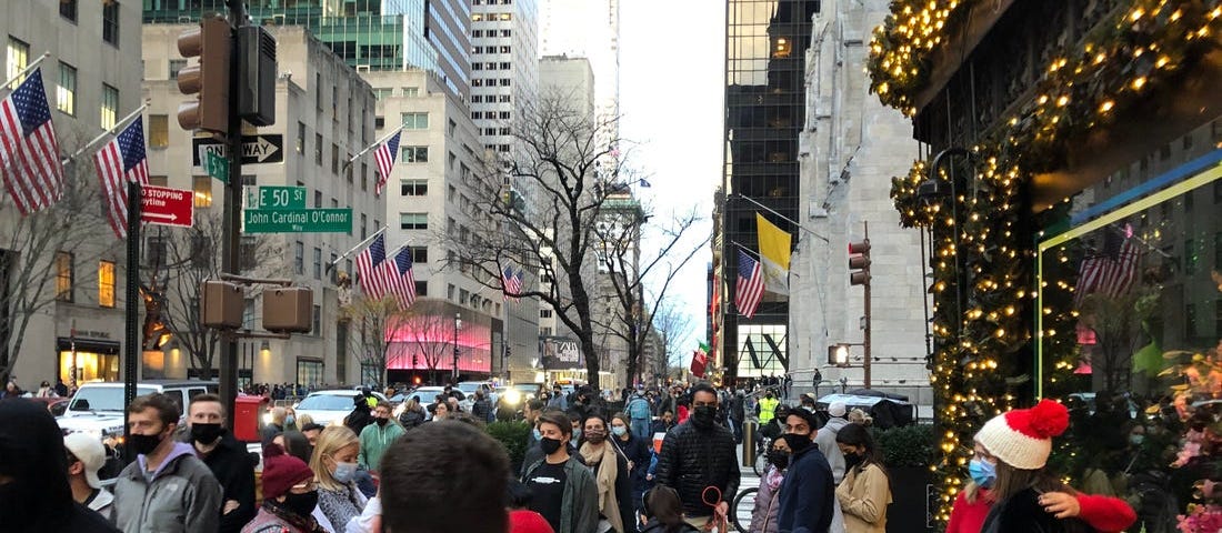 A busy sidewalk on Fifth Avenue.