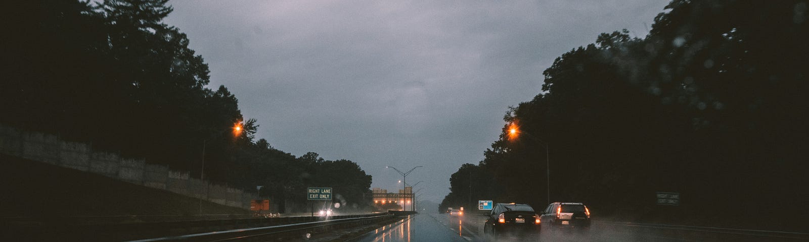 Dark night driving on a road in the rain.