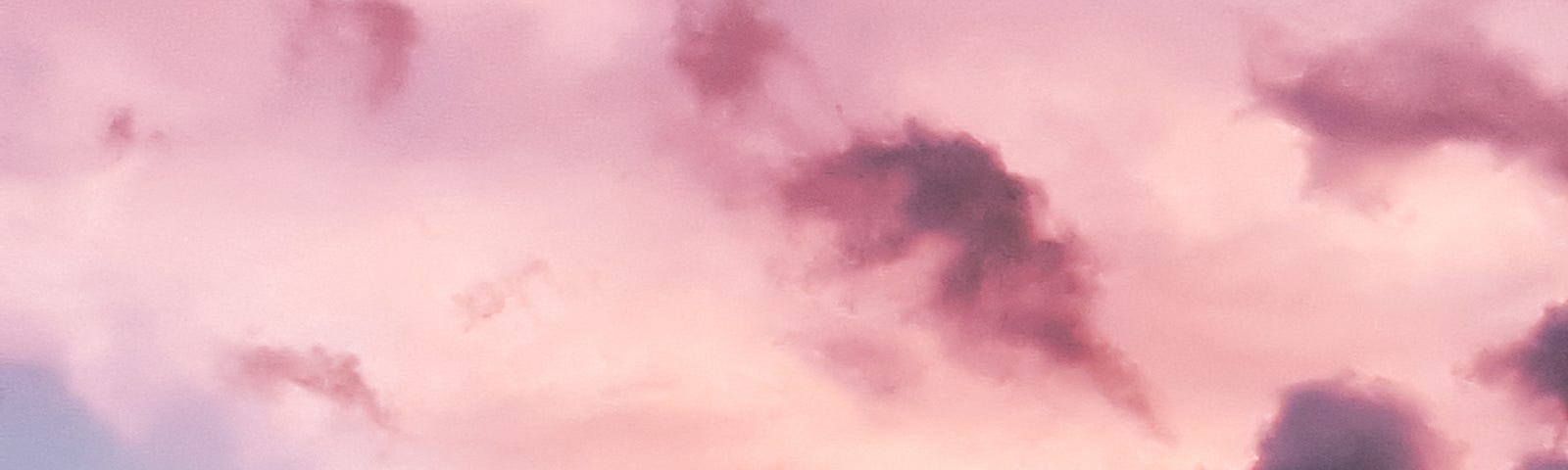 An array of different shades of pink clouds presumably near sunset.