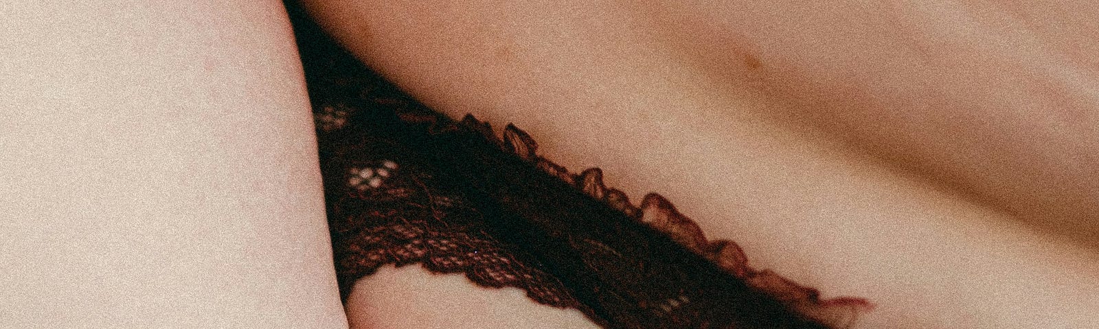 Wrinkles of skin with a black lace strap