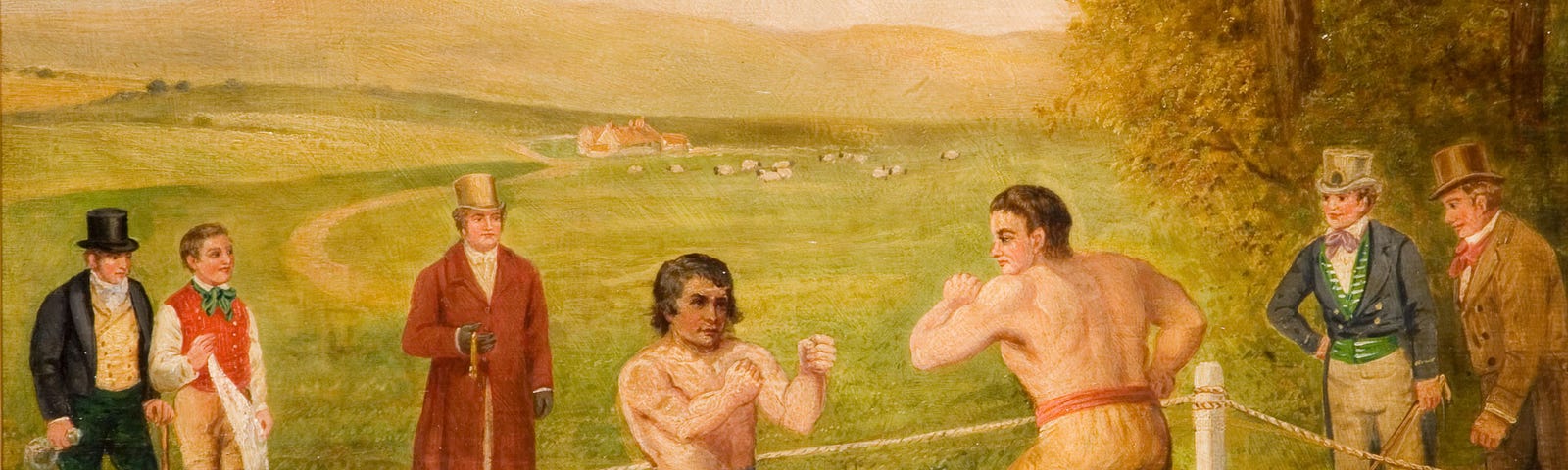 Two men boxing on a grassy field