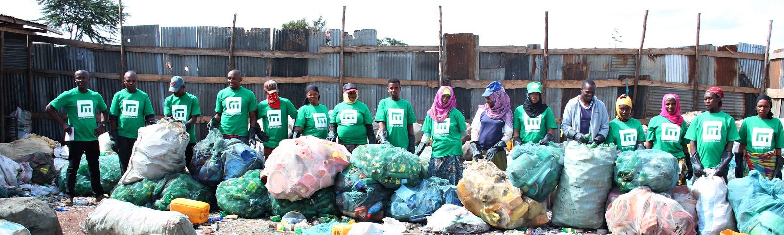 A handful of the fantastic waste collectors from our clean-up in Arusha with the waste collected during the clean-up.
