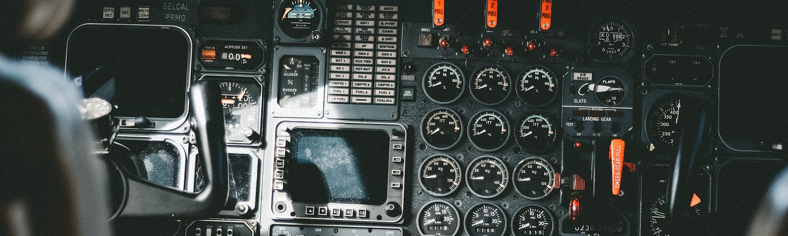 View of an airplane cockpit, showing lots of gauges