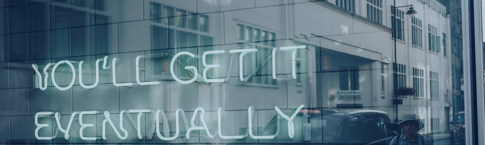 A neon sign displaying “You’ll get it eventually”