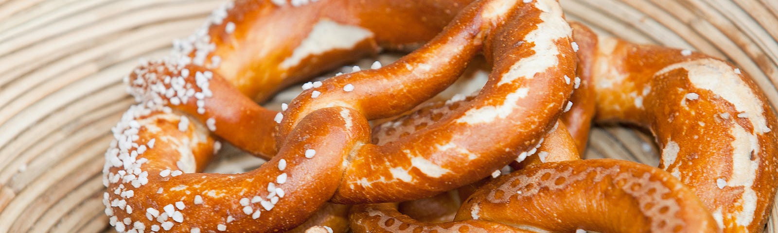 A close up of salt-covered soft pretzels