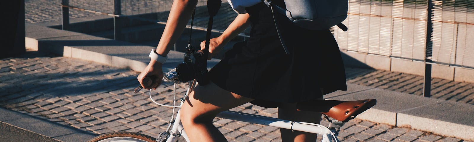 A young girl riding an average ten-speed bike.