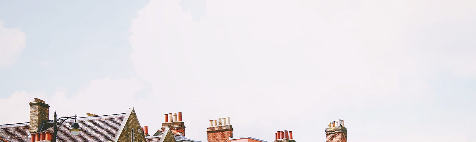 A row of brightly coloured terrace houses.