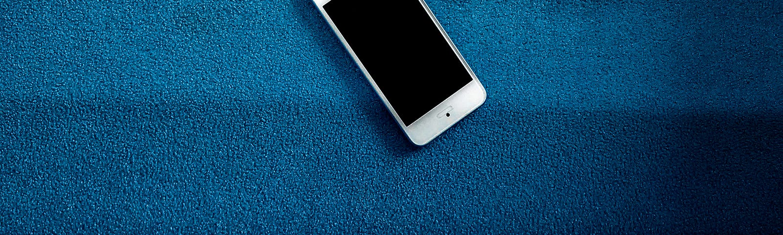 Phone over a blue backdrop