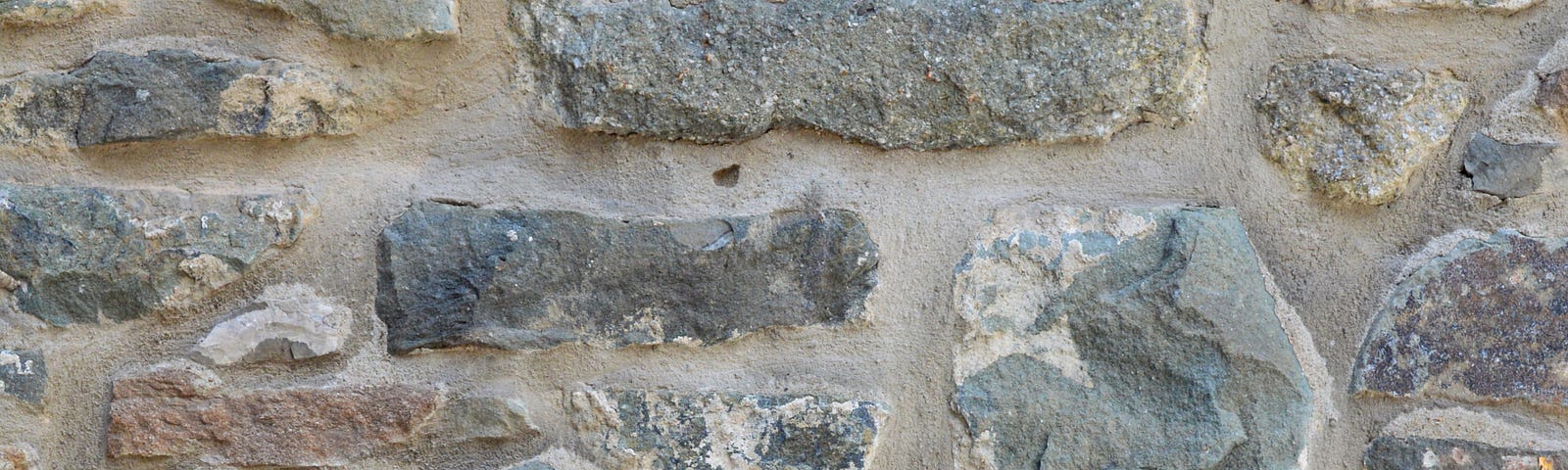 A section of rubble stone walling.