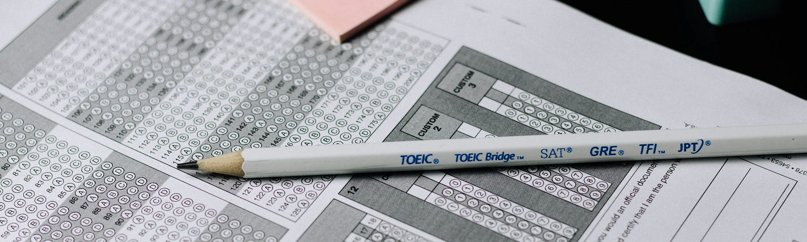 A standardized test bubble answer sheet with a pencil on it