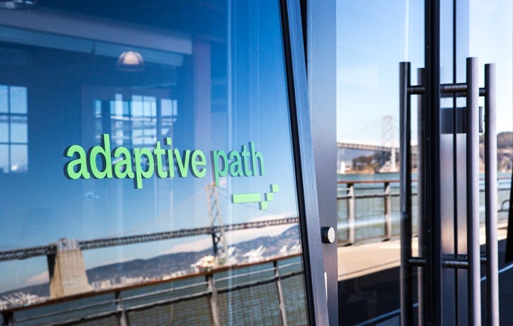 A window with the words “Adaptive Path” afixed to it