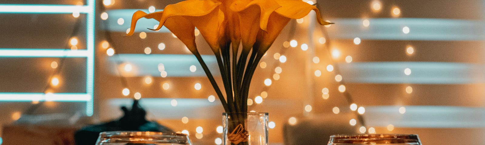 lilies and wine glasses and fairy lights