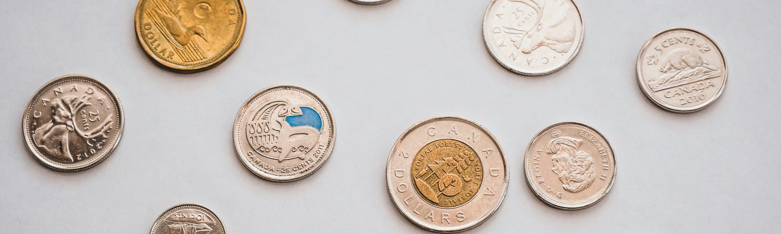 Canadian coins — dimes, nickels, toonies, and loonies