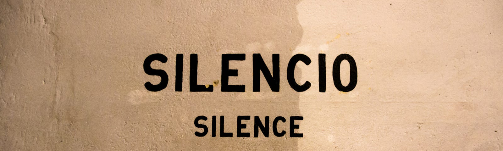 Picture of a sign reading “Silence” via Alt text on Medium