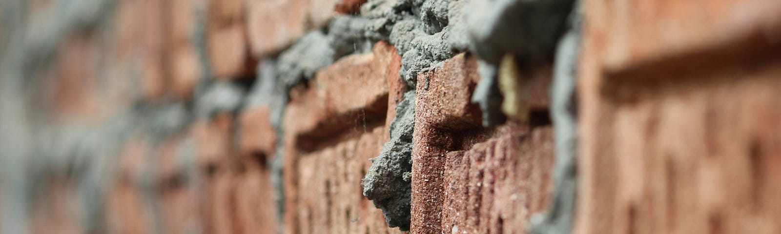 Bricks and mortar form a strong wall.