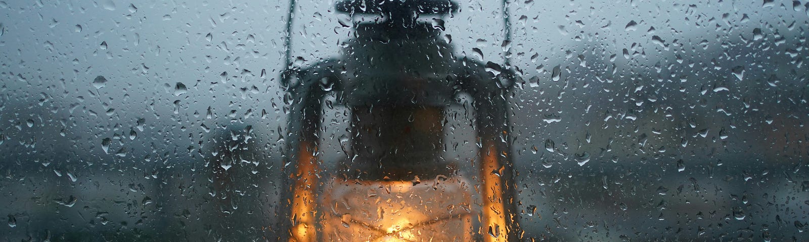 A lit lantern in the rain