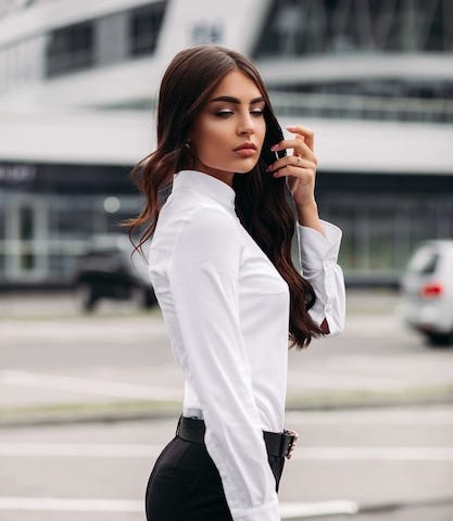 Young brunette woman dressed in office clothes