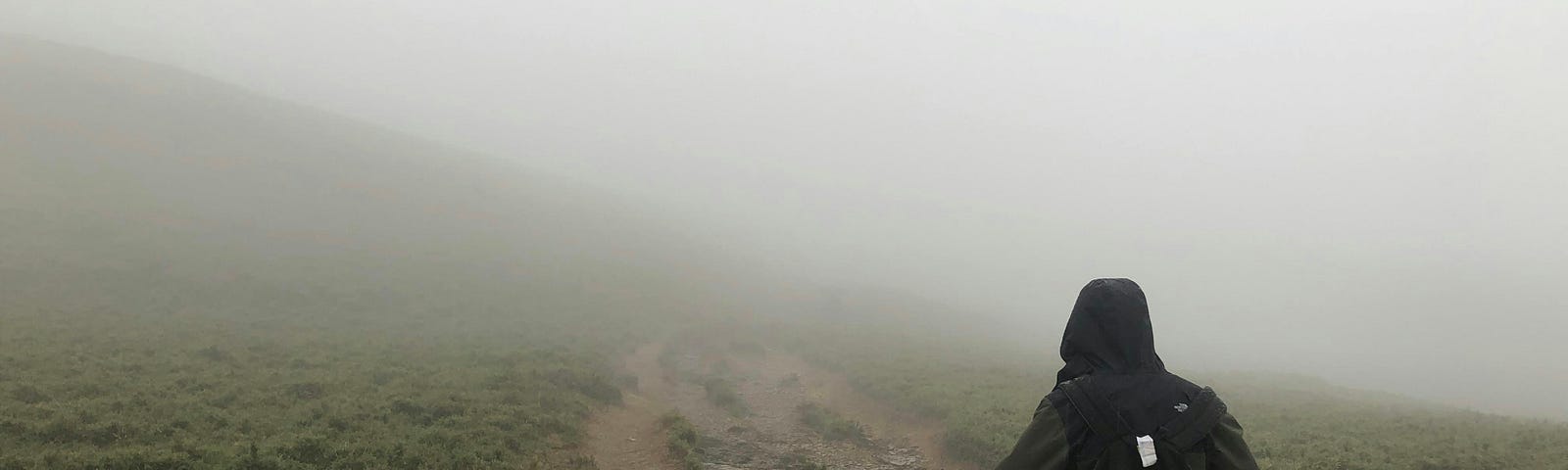 running in a fog on a mountain