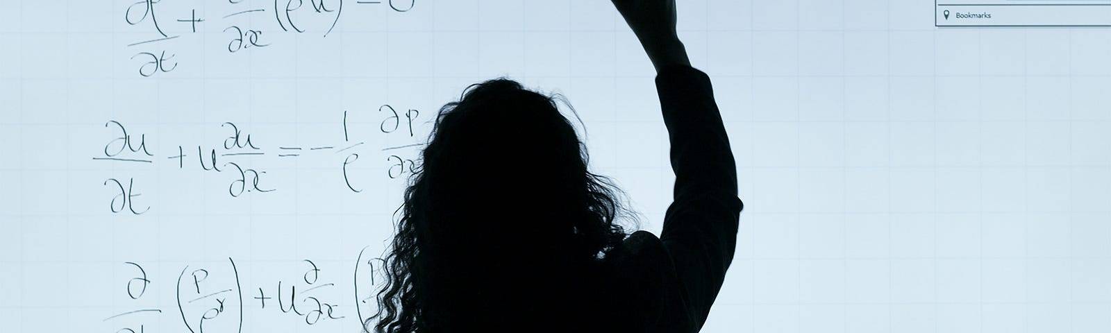 a silhouette of a woman in front of a smart board, working on a math equation