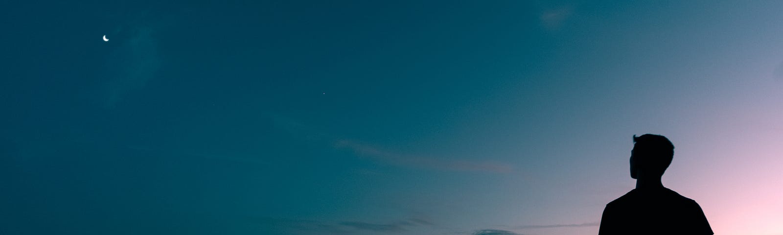 Image of a guy staring at the sky in the evening “I’m An Introvert: Here’s What That Means” on The Reflectionist