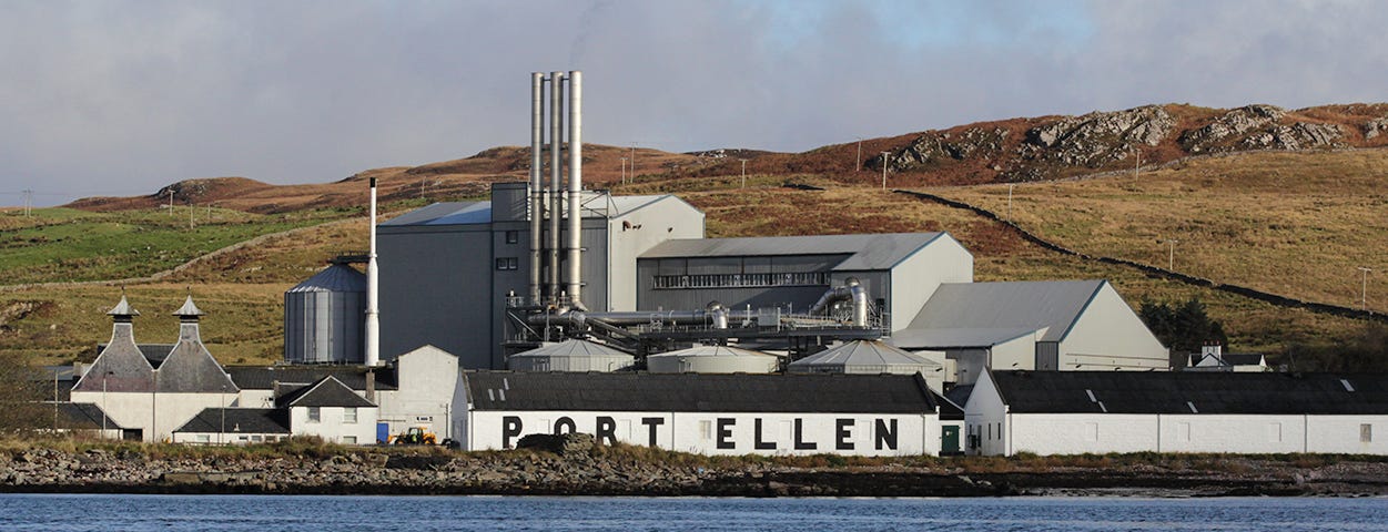 The Port Ellen Distillery and its warehouses, with Diageo's Port Ellen Maltings in the background. Photo ©2017, Mark Gillespie/CaskStrength Media.