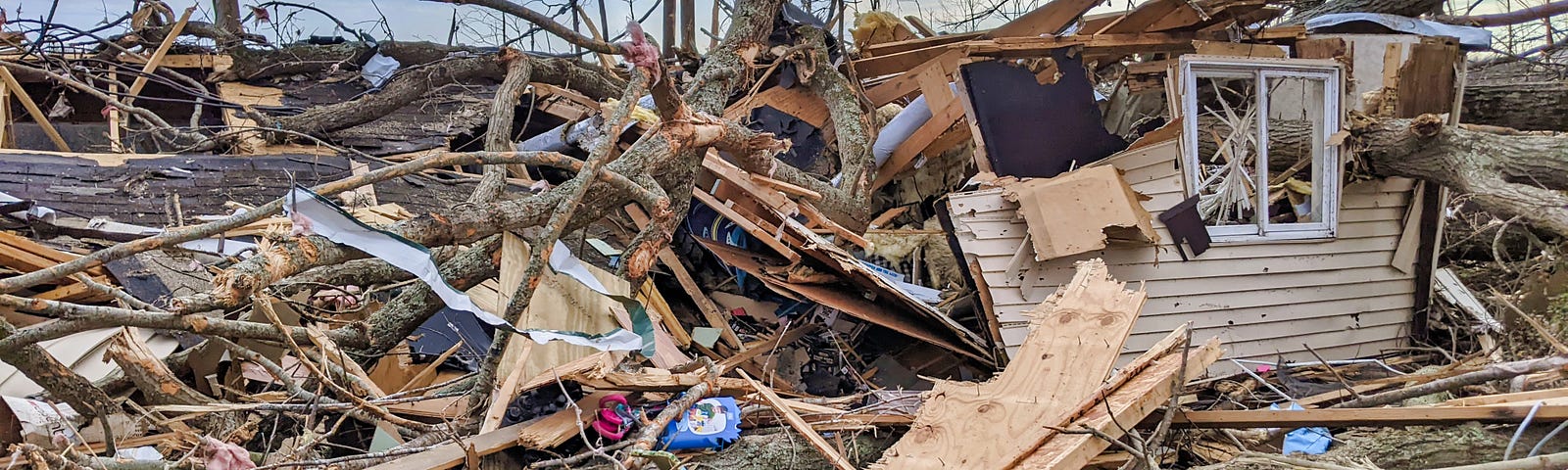 A building totally destroyed in a storm, possibly in a town hit by a tornado.