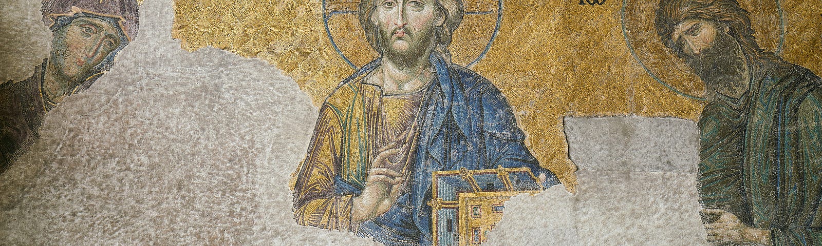 In image of Jesus in the Greek Coptic sytle with a halo circle behind his head. along wtih two other teachers or discilples. its an unfinished fresco. so bottom half of the image is undecorated.