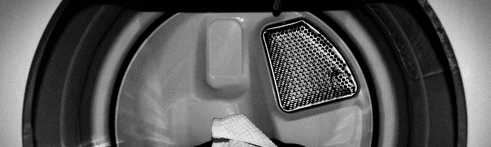 black and white image of the inside of a dryer