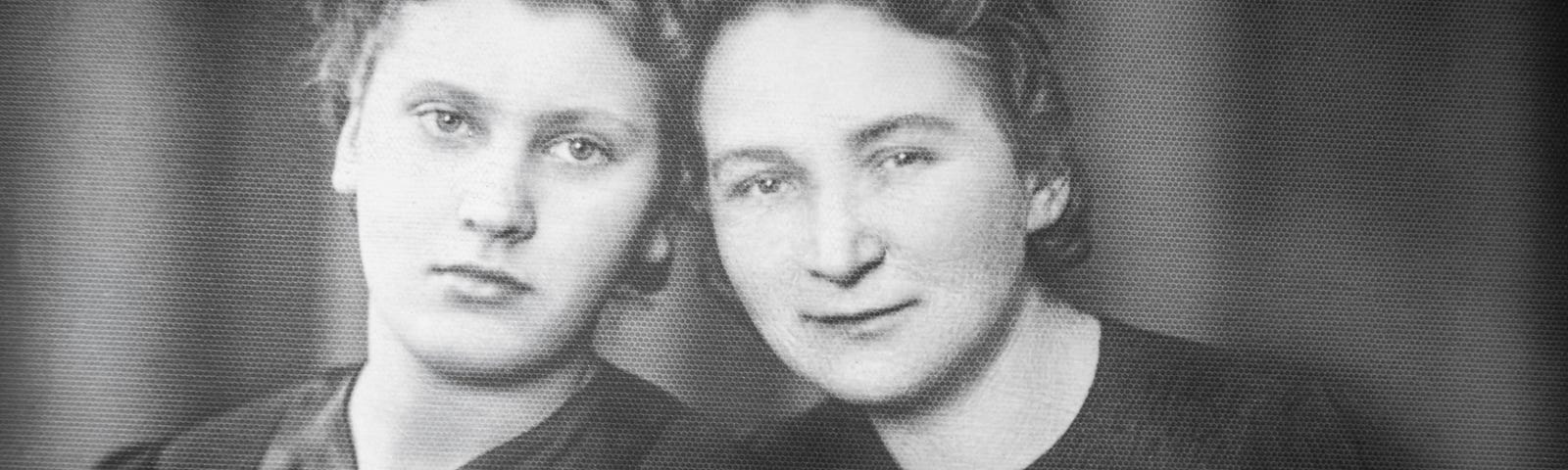 Black and white photo of two young women, friends, smiling