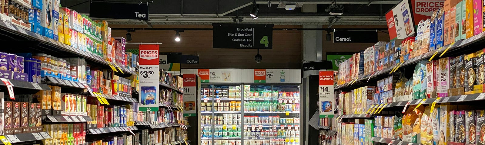 Fully stocked shelves in a supermarket.