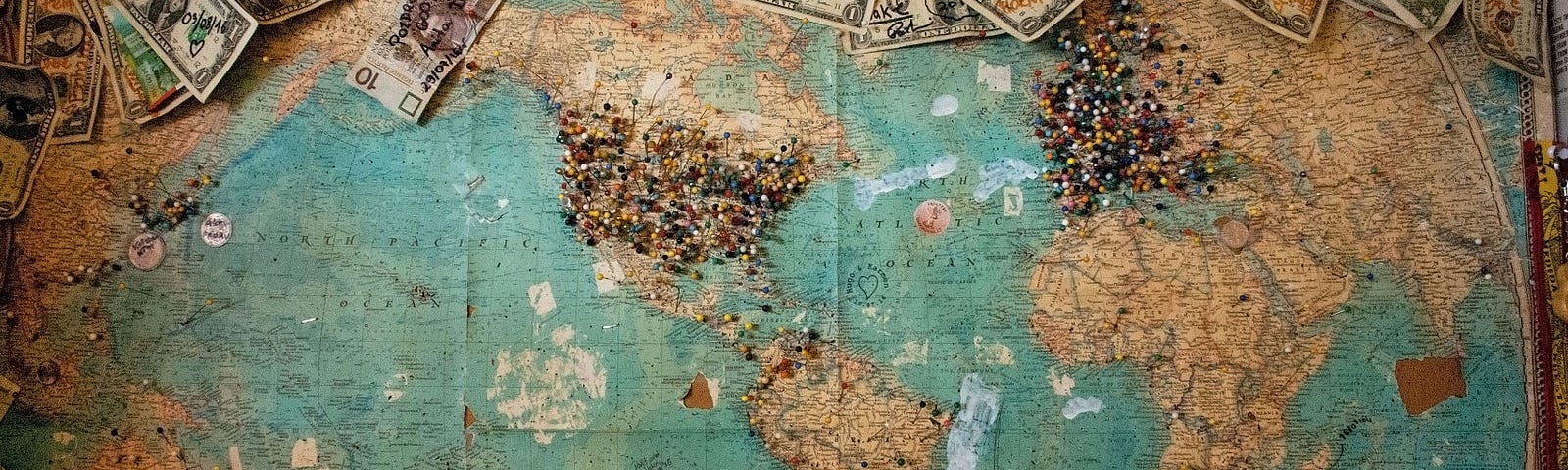 A mucky picture of the world with banknotes scattered around.