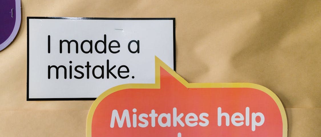 Inspiring quotes about making mistakes on brown paper